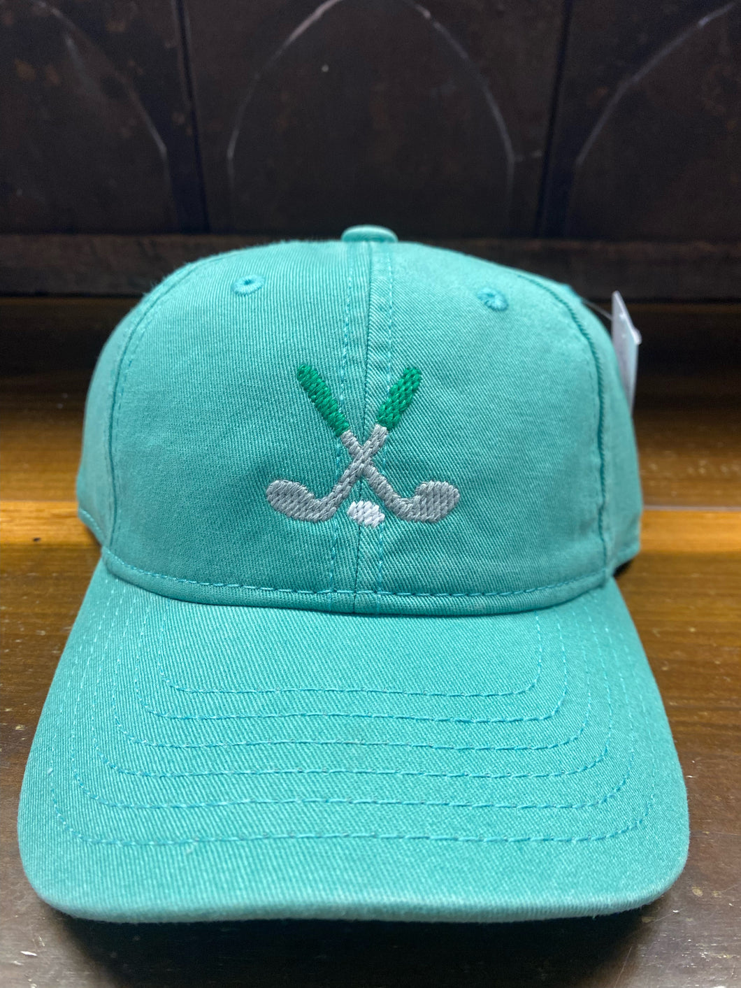 Golf Clubs on Mint Baseball Hat